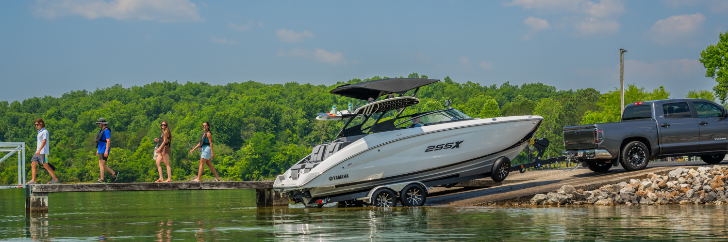 Boat being picked up for delivery by Highway Marine